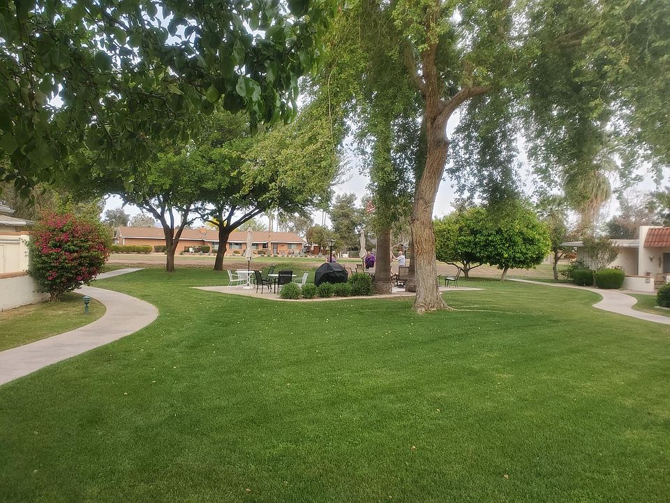 View from patio of sitting area with BBQ
and golf course fairway behind it.