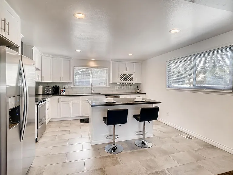 Newer Kitchen with Stainless steel appliances and quartz countertop