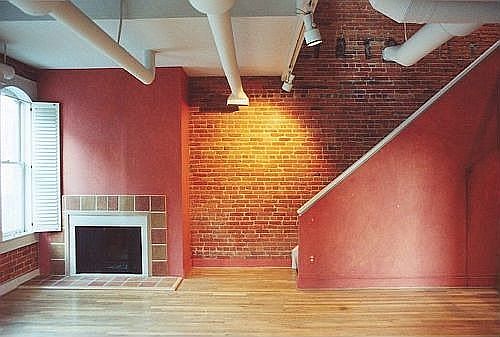 1st floor facing N.  Working fireplace.