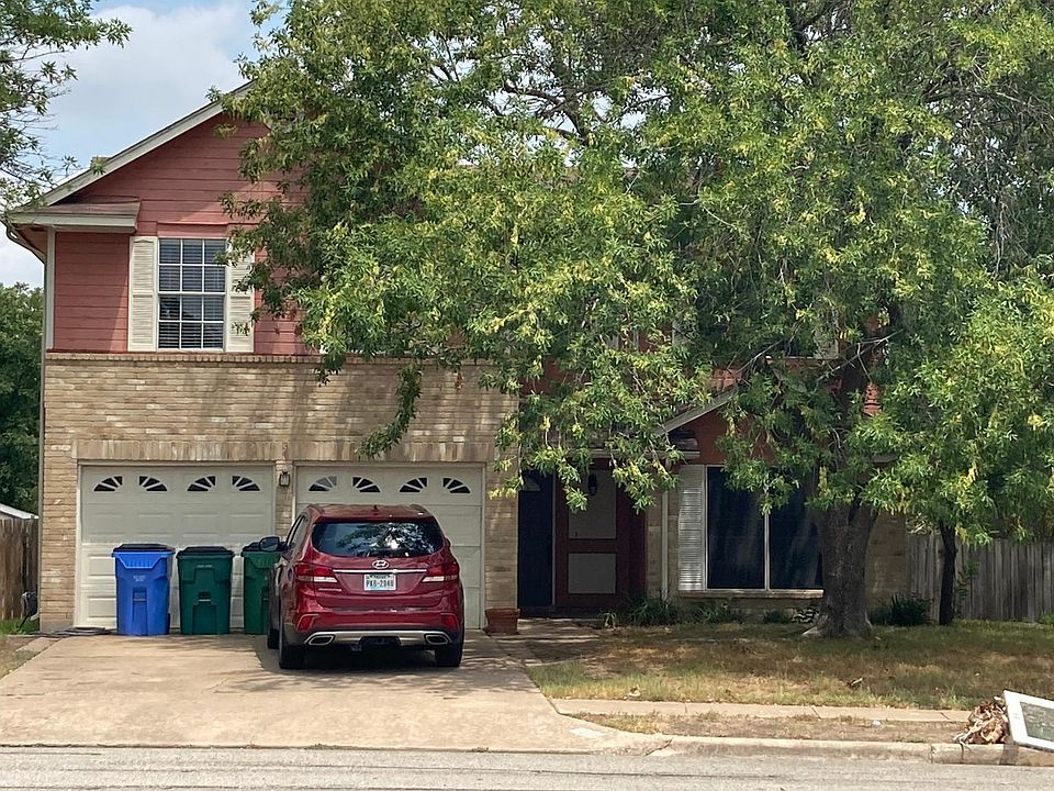 Front of house. Two car garage.