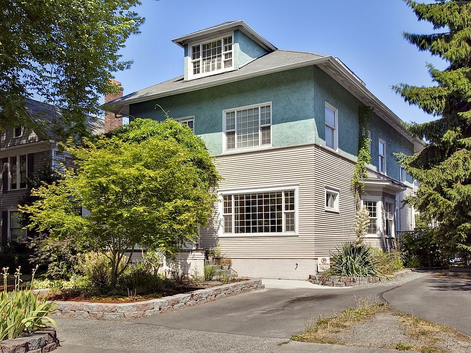 Front exterior of building with one parking space.