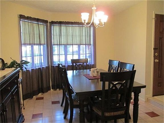 The bay window is a great accent to the dining room.
