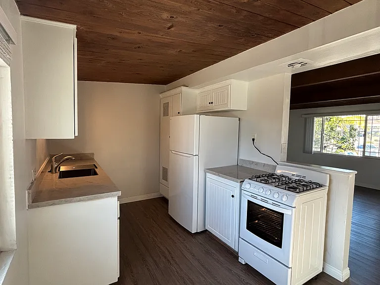Kitchen with a new refrigerator and new quartz countertops