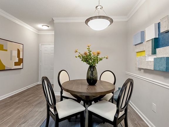 Interior view of our modern dining room, wood inspired flooring, modern lighting