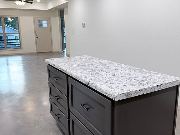 5 ft island with storage . Open floor plan into dining and living area.
