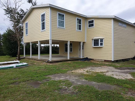 Large back yard and covered back porch.
