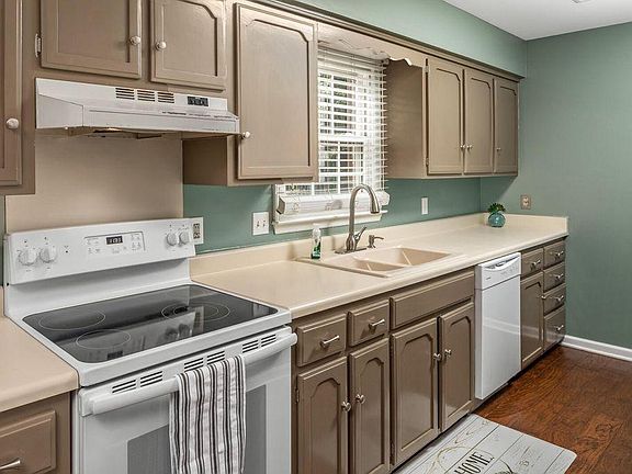 Electric Stove Top, Dishwasher in the updated Galley Kitchen
