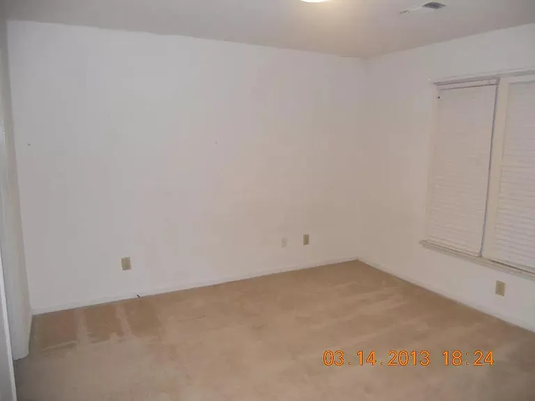 guest bedroom with private bathroom and closet