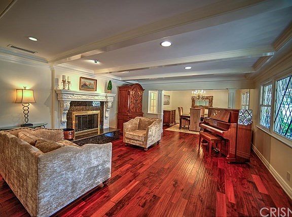 Living room with beveled and leaded glass windows,