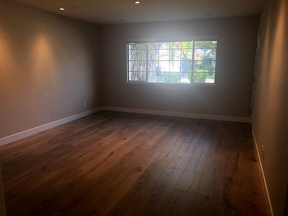 Living room but with angle to see the front entrance