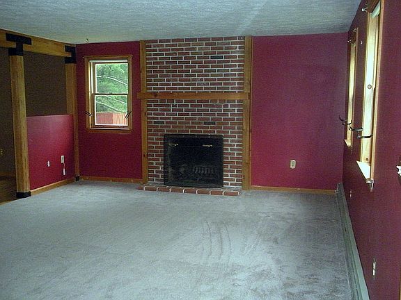 Carpeted Family Room with Fireplace