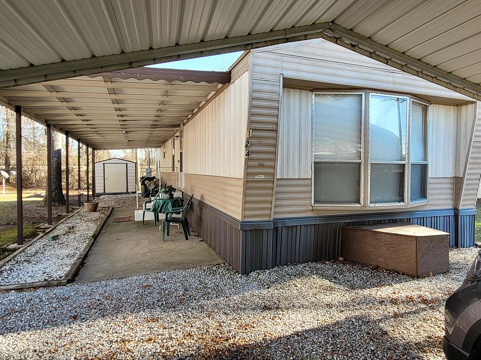 Doublewide with covered patio and storage bldg