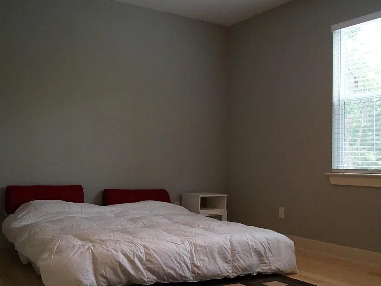 Upstairs bedroom #3 (view 2). Extremely large bedroom with walk-in closet and plenty of windows. A little larger than 18'3" x 12'3.5"
