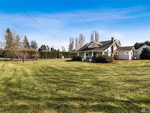 Set back from the street, the front lawn is large and expansive. 