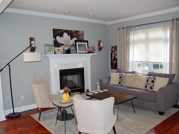 living room with gas fireplace and hardwood flooring