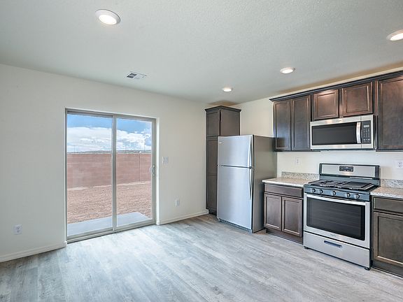 Spacious kitchen with access to the back yard.