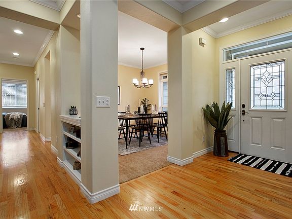 Formal dining space, lots of lighting and hallway to second and third bedrooms.
