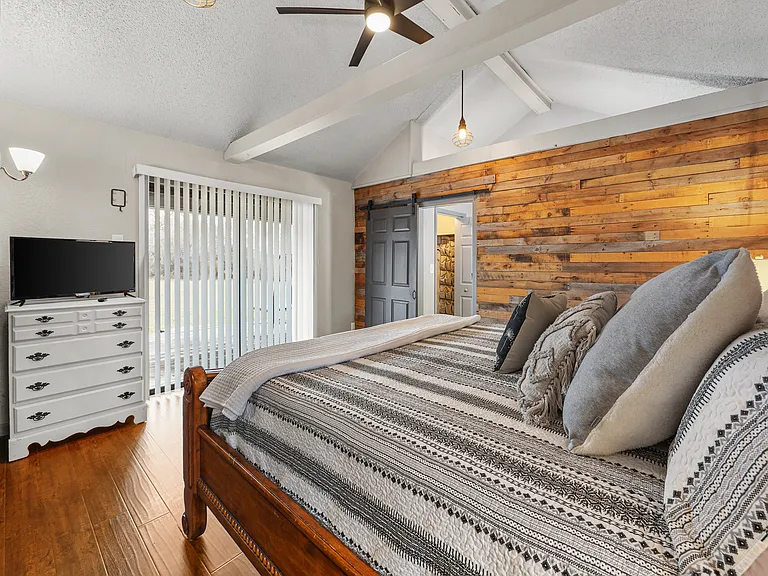 Primary bedroom with tv