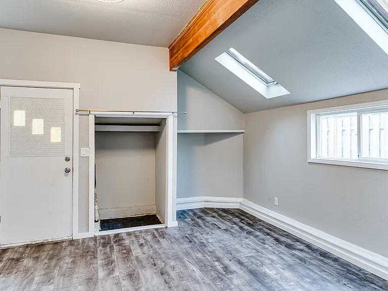 Two skylights and direct access to your private fenced backyard.