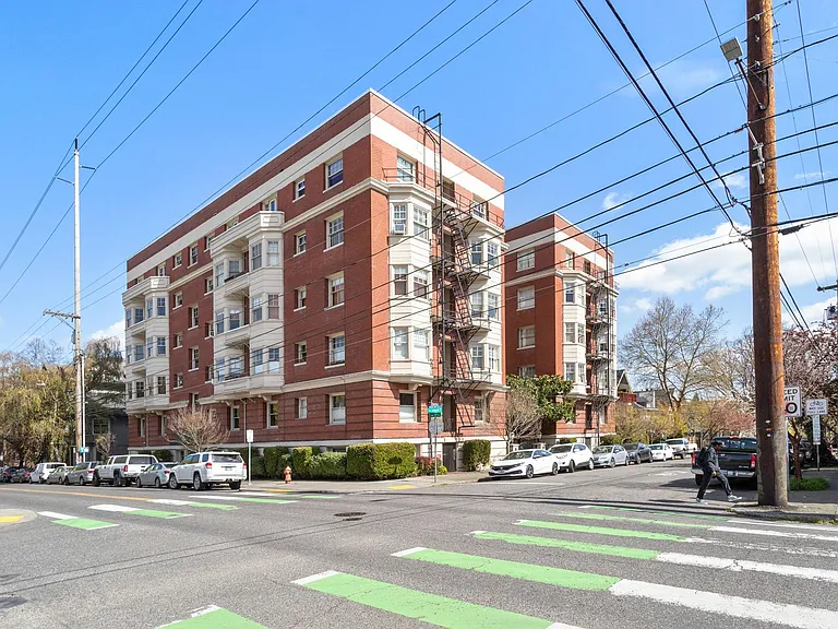 View of our building from the west corner of Johnson St and 21st Ave. Total # of units is 39