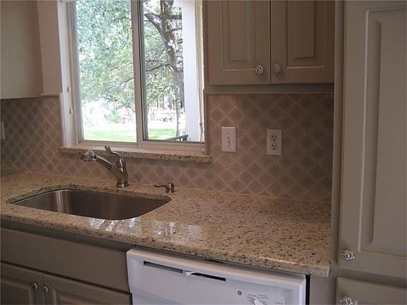 Wonderful granite counters, stone back splash, large stainle