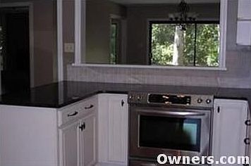 kitchen aid stainless stove. pull-outs in cabinets.