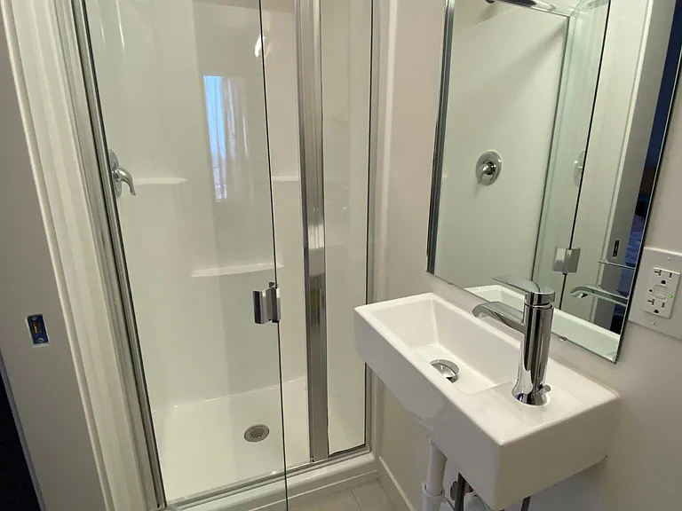 Bathroom #1: Full bathroom from first floor (shower, sink, and toilet)