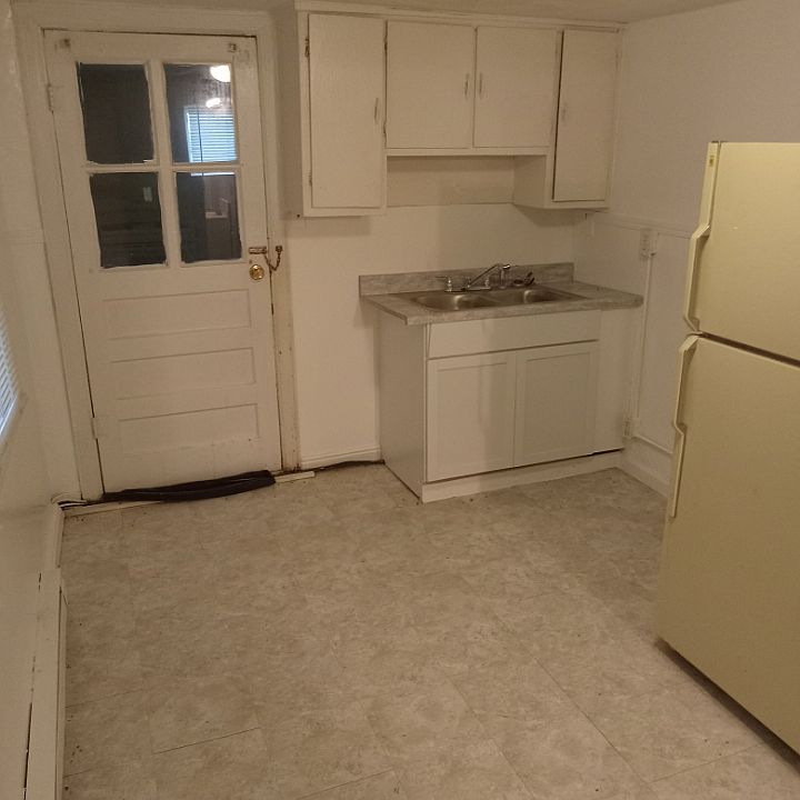 kitchen, door leads out to utility area