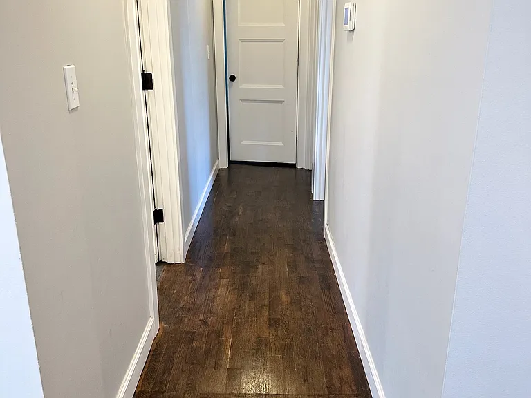 Hallway to 3 rooms and main bathroom