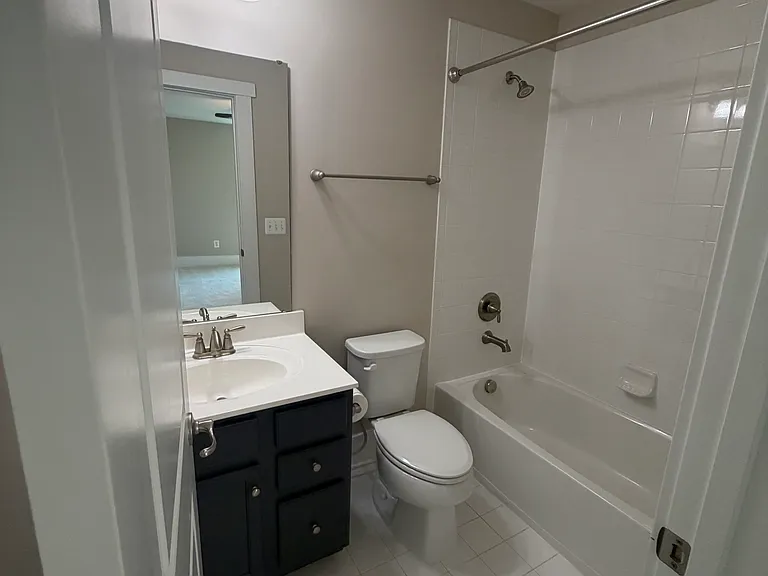 Private en-suite bathroom in Bedroom #4 featuring a tub/shower combination.
