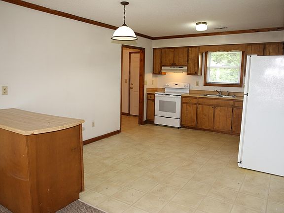 Kitchen with glass top range.