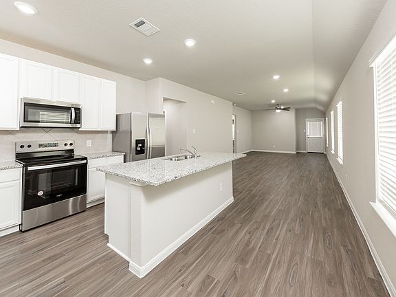 Kitchen to Dining Area and Family Room