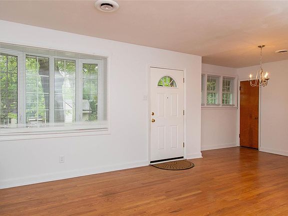 The living room dining room combination. There are wood floors throughout & double pane double hung vinyl windows w/ a living ro