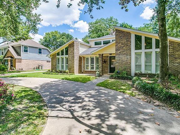 Mature trees in the front yard give ample shade.