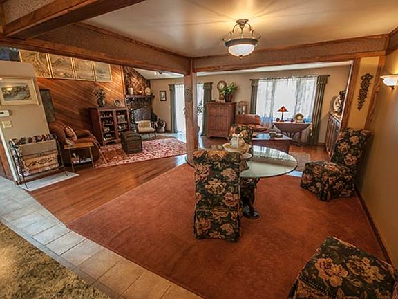 Dining room space (11x11) with beautiful ceiling border and elegant carpeting.  Glass doors lead to the back porch with large windows offering a nice view of the back yard.