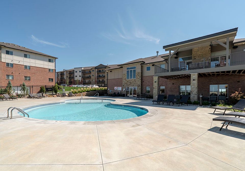 On a hot day, you'll love taking a dip in our resort-style pool with poolside lounge chairs.