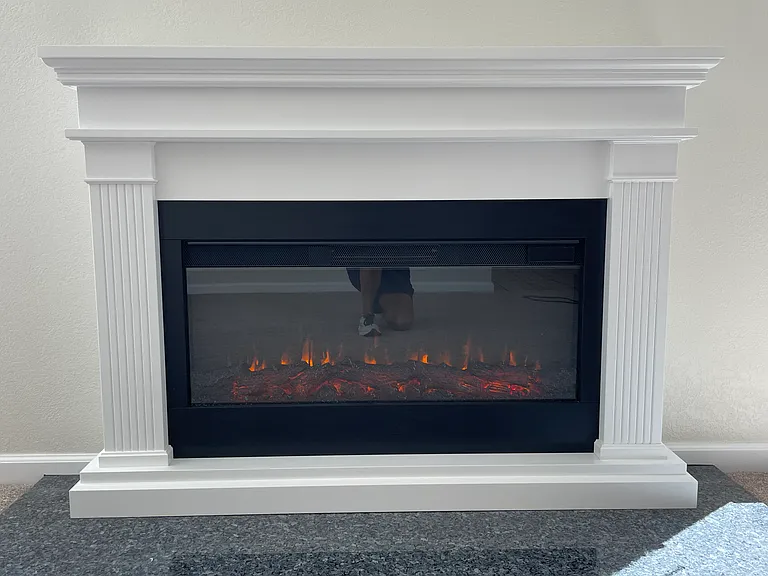 New electric fireplace insert (with remote control) and mantle. Beautiful granite base.