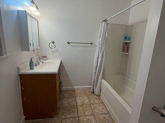 Main bathroom with shower and bathtub
