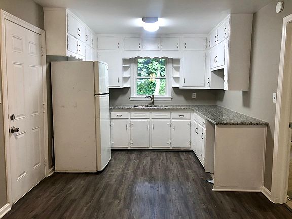 Kitchen - updated white cabinets, new granite counter tops, new floors, new appliances to be placed before move in