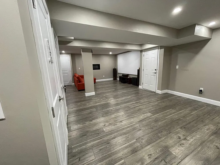 Fully Finished Basement with Hardwood flooring, Hometheater Hookups and electric fireplace