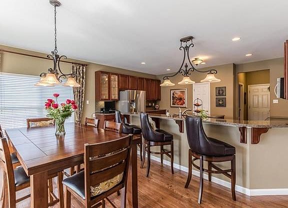 Beautifully updated kitchen with hardwood floors, stainless steel appliances, granite counter tops, 