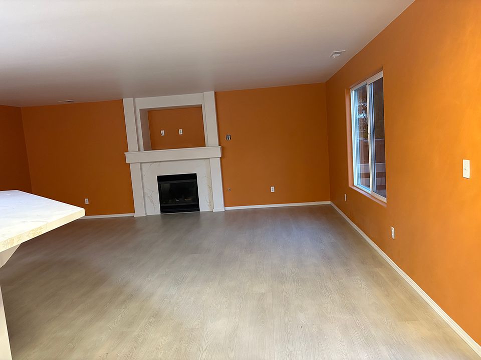 Family room with Fire Place wrapped by Quartz, New LVP Flooring through out easy to clean