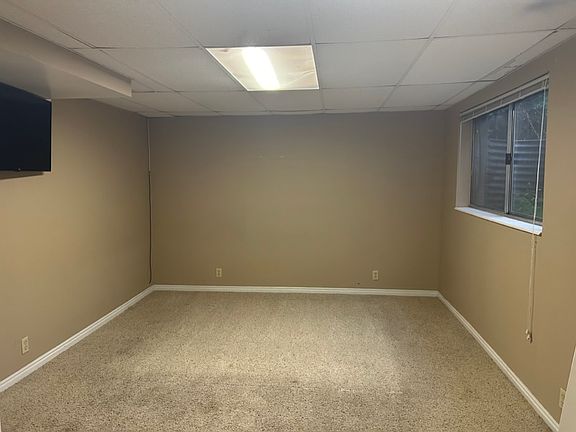 Bedroom 1 with a hanging TV