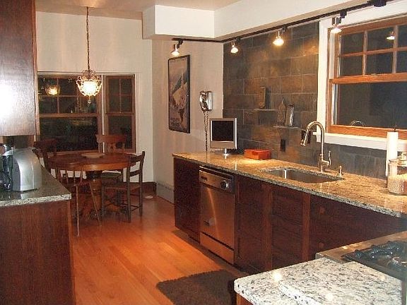New kitchen with granite counters & slate backsplash