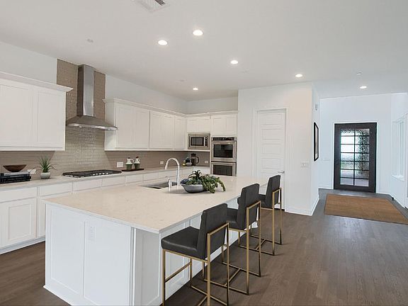 Gourmet kitchen with island, virtually staged for demonstration