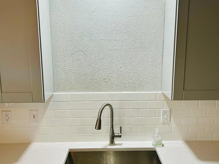 New Carrera Quartz countertops, new square stainless steel sink, new faucets, new backsplash, new appliances