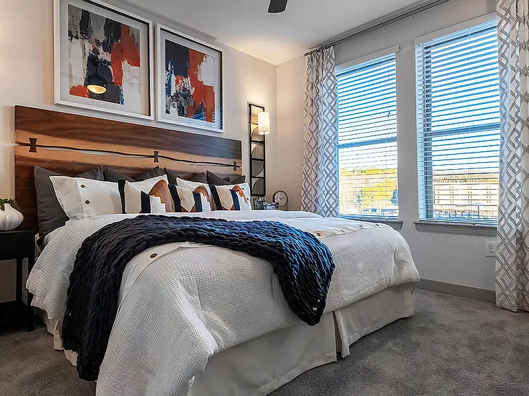 Well-Lit Bedroom Featuring Modern Decor and Ample Natural Light
