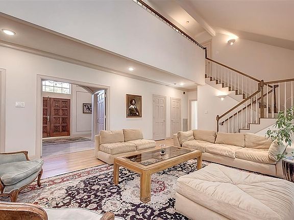 Impressive Foyer and Den, abundance of Coat closet as well as a safety Tornado  closet room. Note three Closets doors in passageway!