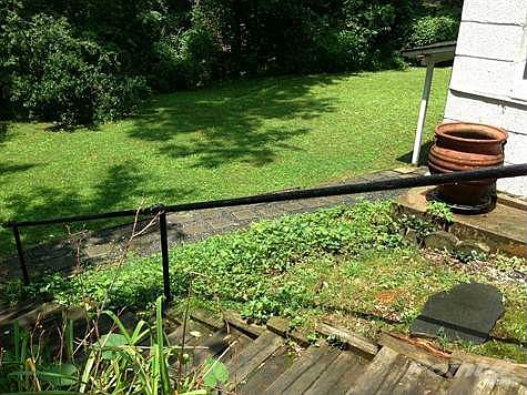 Walk way down exterior steps to basement.
