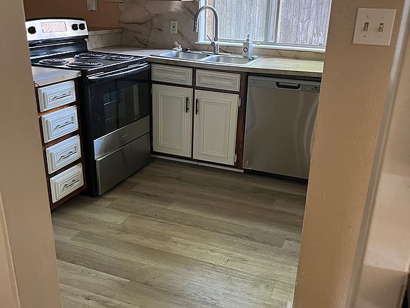 KITCHEN - appliances included are Elect. Stove, Dishwasher, Fridge.